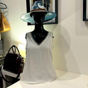 White sleeveless top